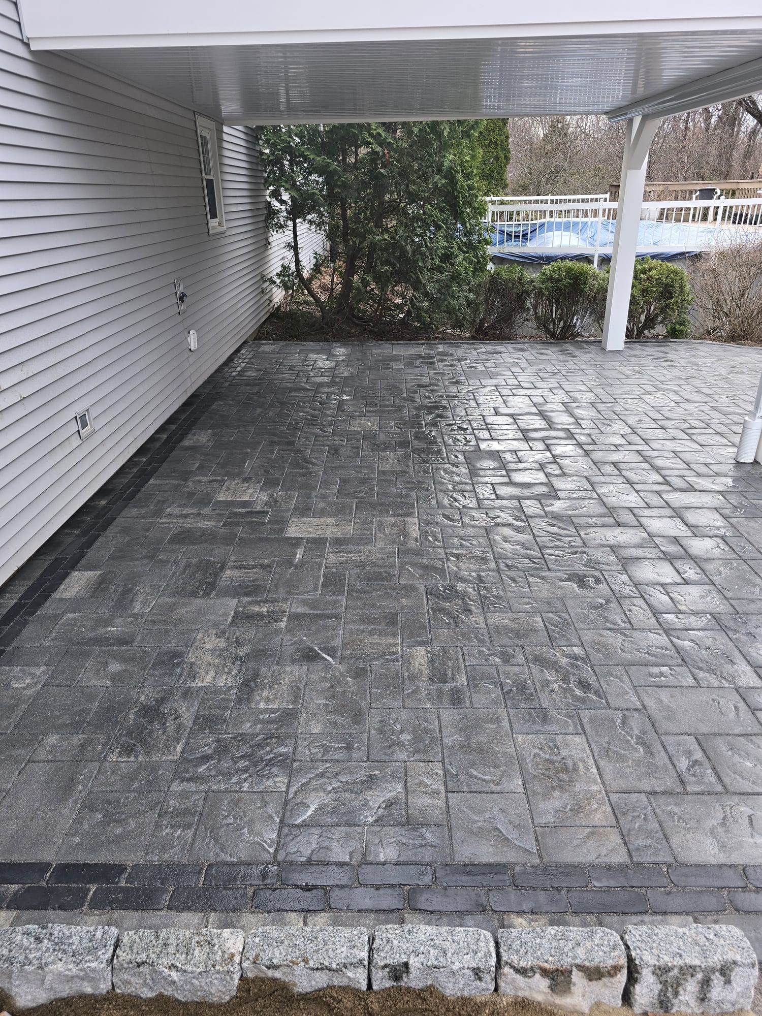 Covered patio with a charcoal-blue finish