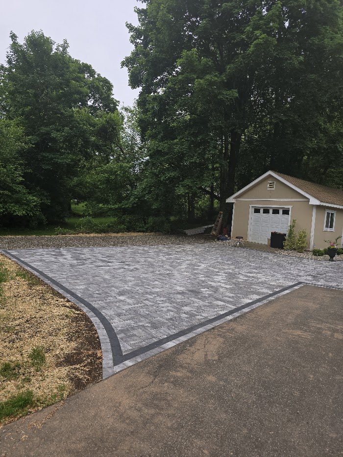 Paver driveway to a detached garage