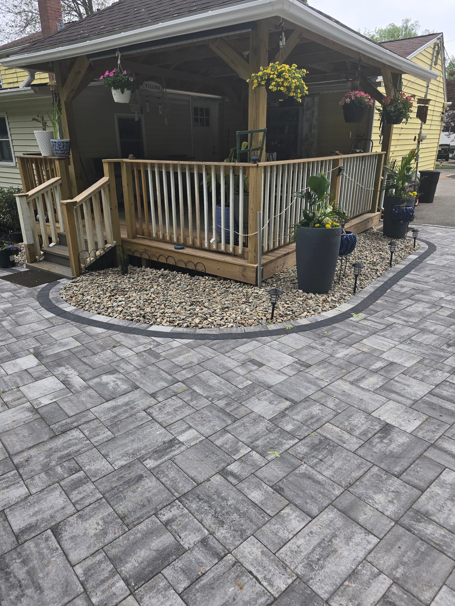 Backyard patio beneath a wood deck