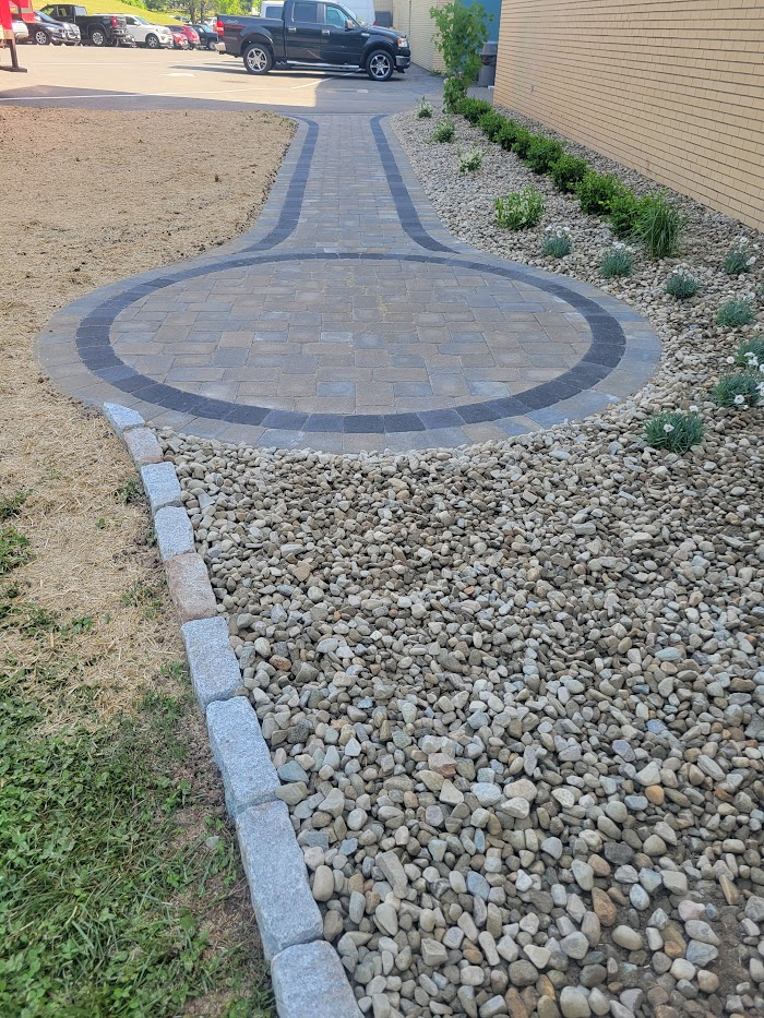 Paver medallion in a river-rock bed