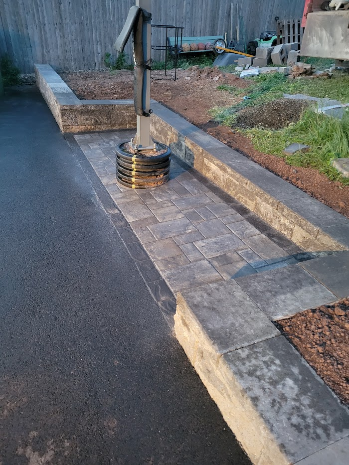 Walkway with a retaining wall