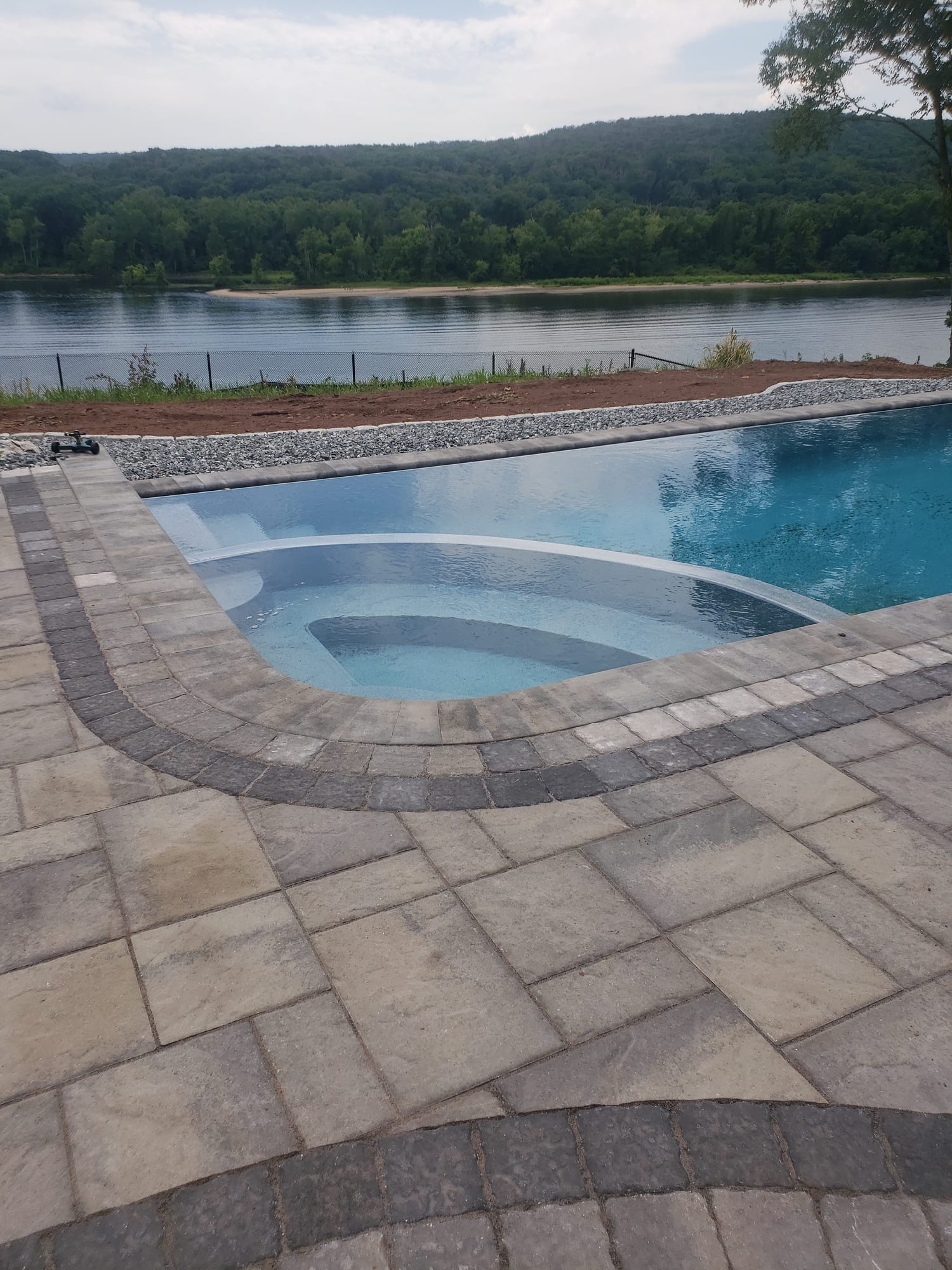 Granite steps to a poolside patio