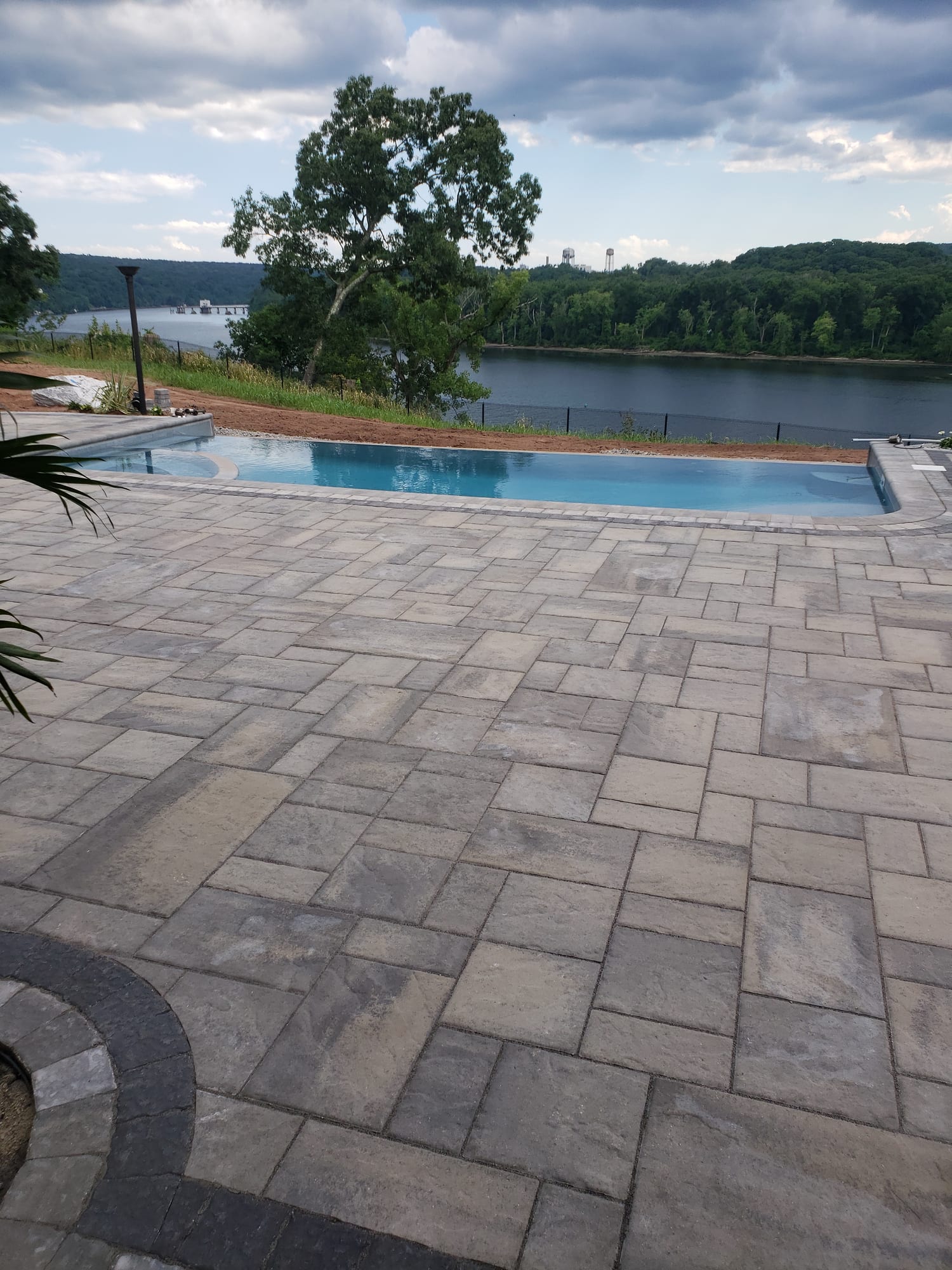 Poolside patio under a shade tree