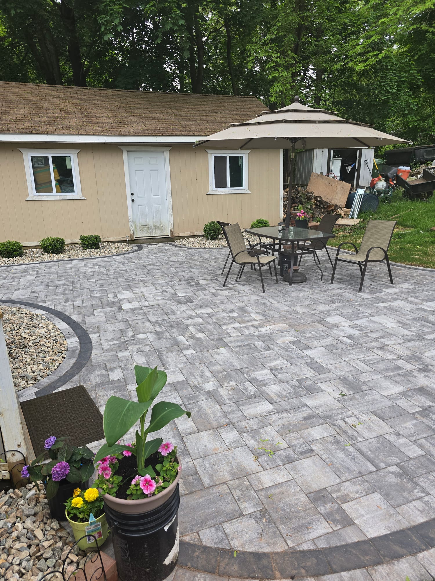 Backyard patio with a shed and dining set