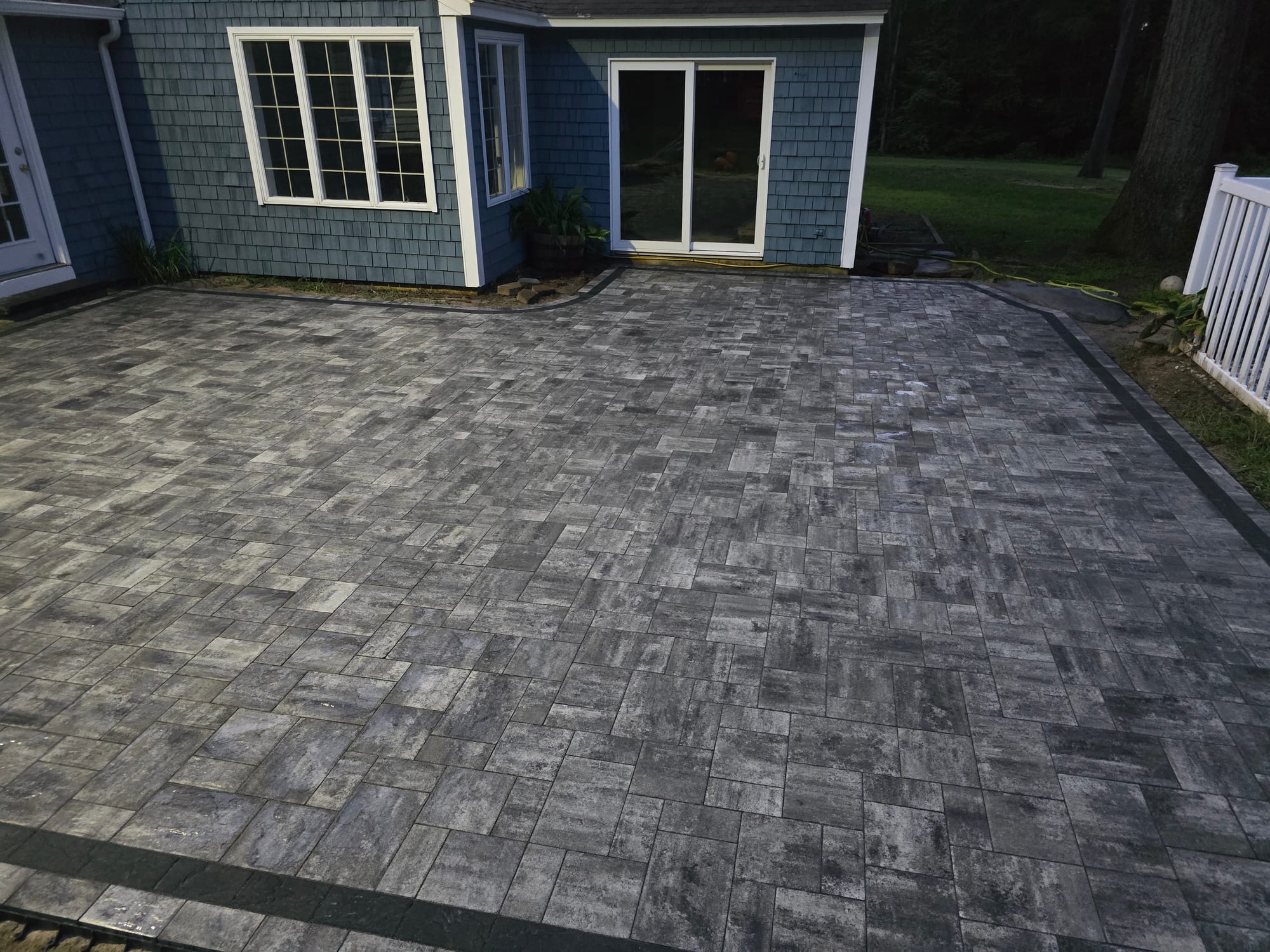 Backyard patio with a sealed charcoal finish